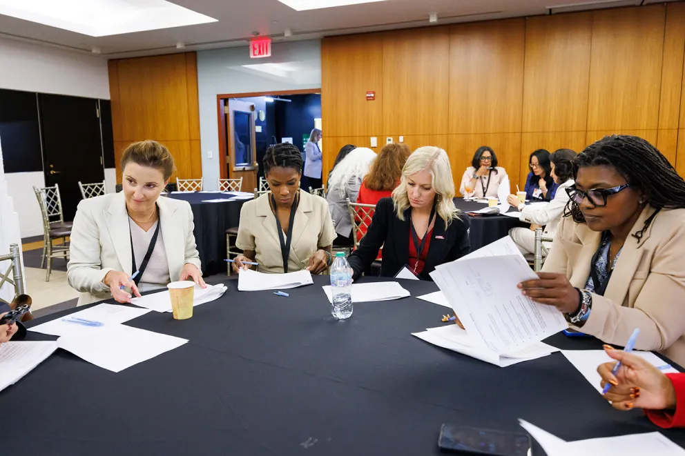 Global Summit 2025 - People Sitting Around Table